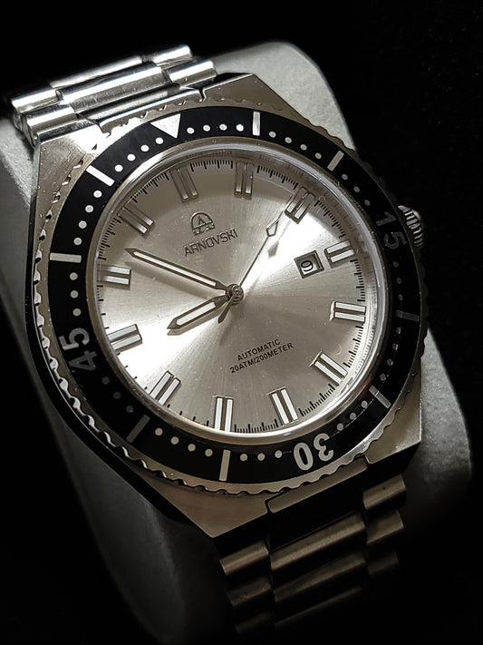 Silver with White dialon Black bezel