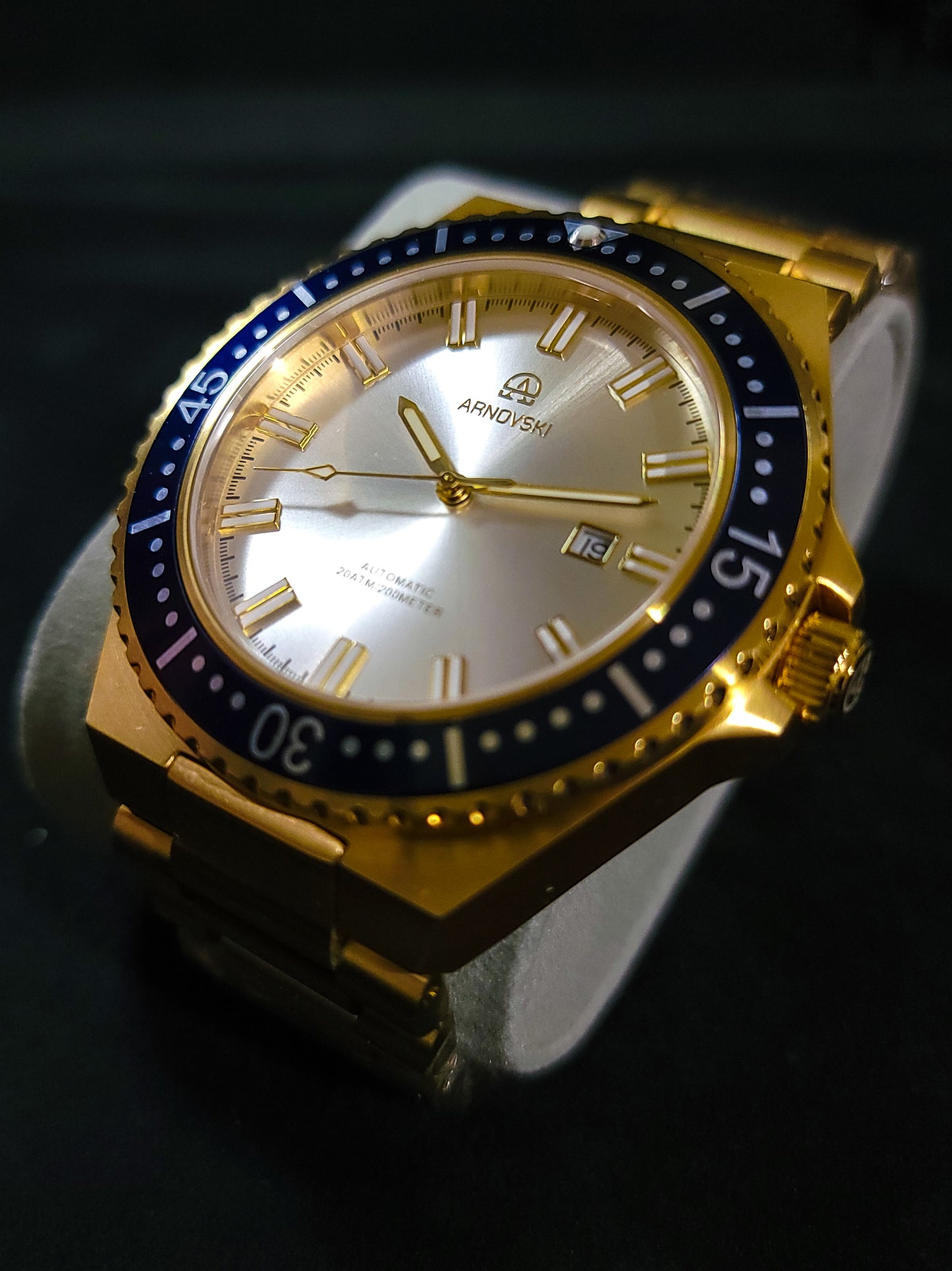 Gold with Blue bezel and White dial