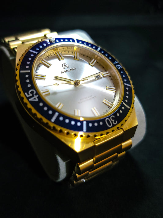 Gold with Blue bezel and White dial
